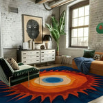 Vivid sunburst rug in an industrial brick loft with green velvet chair and tall houseplant