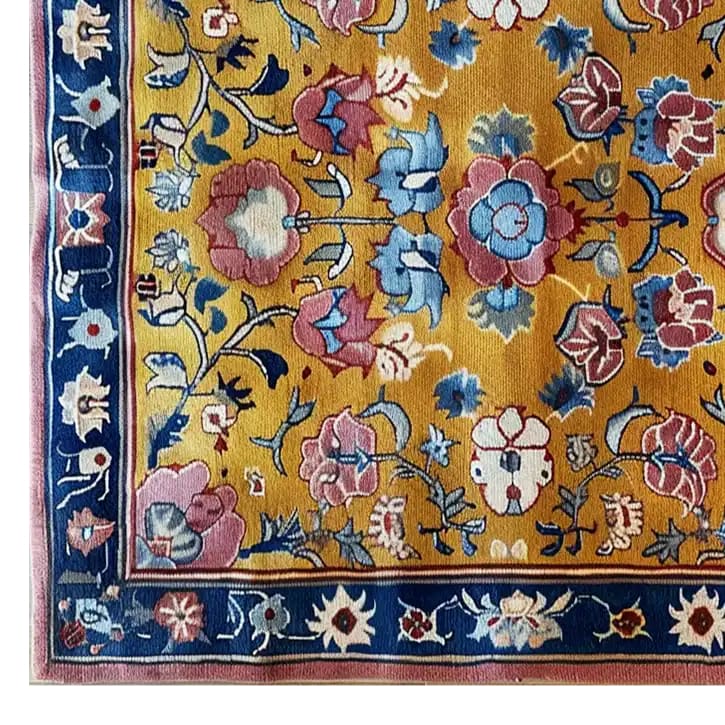 A vibrant area rug featuring a sunlit floral symphony design, showcasing an intricate pattern of colorful flowers on a warm yellow background. The rug is hand tufted from wool, perfect for large living rooms. This floral rug is an ideal choice for those looking for living room rugs sized 8x10.