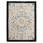 Sunlit Garden Hand Tufted Wool Rug featuring a beautiful floral design. This elegant area rug showcases a central sunburst pattern with delicate branches and leaves in soft pastel shades, framed by a bold black border. Ideal for adding a touch of nature-inspired charm to living room area rugs collections.