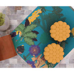 Top view of a vibrant Sunlit Jungle Symphony Peacock Hand Tufted Rug in blue, featuring a colorful jungle motif with birds and foliage. Perfect for large living rooms or dining rooms, this wool rug adds a lively touch to any living room area.