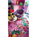 Bright and colorful living room featuring a Sunrise Bloom Hand Tufted Round Rug. This large area rug is an exquisite wool rug with vibrant floral patterns, perfect for adding a splash of color to your living room. The round rug design enhances the room's aesthetics, making it a standout choice for rugs for living room settings.