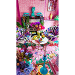 Vibrant living room featuring a Sunrise Bloom Hand Tufted Round Rug. This large area rug showcases a vivid floral pattern, perfect for adding color to any living space. The wool rug complements the colorful decor with its intricate design, making it an ideal choice for those seeking stylish rugs for living rooms.