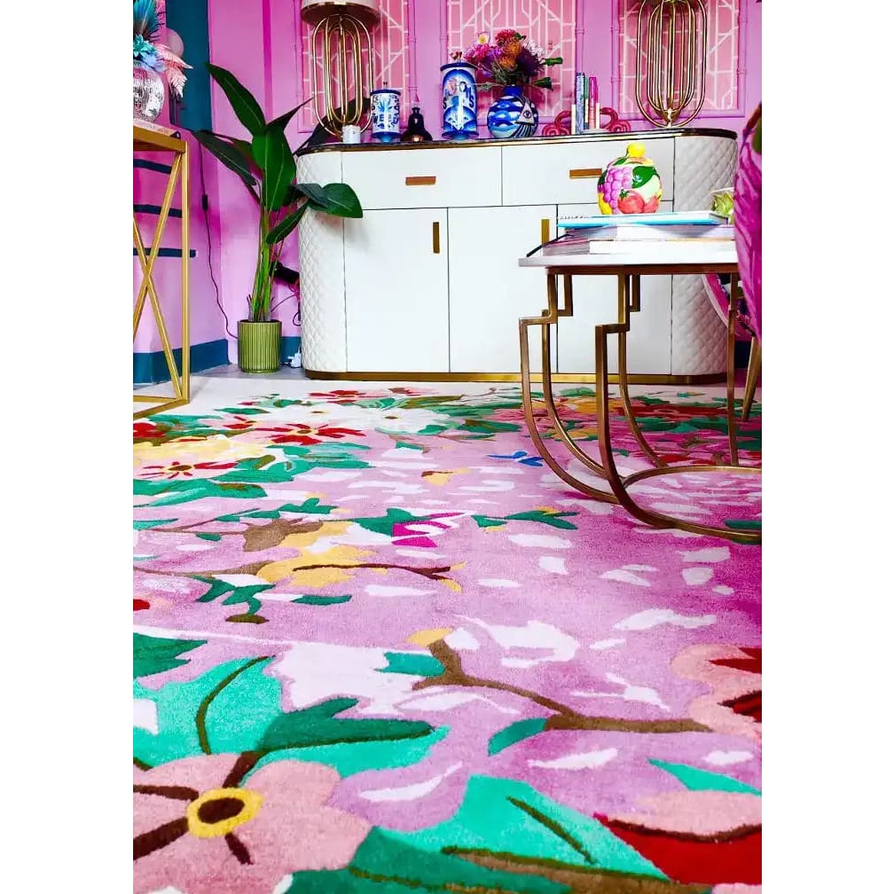 Bright and colorful Sunrise Bloom Hand Tufted Round Rug featuring a vibrant floral design, perfect as a large area rug for the living room. This wool rug adds a pop of color and style, making it an ideal choice for those looking for unique round rugs or living room area rugs that stand out.