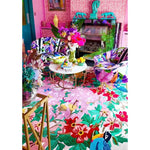 Vibrant living room featuring a Sunrise Bloom Hand Tufted Round Area Rug with a colorful floral design. This large wool rug adds a lively touch to the space, perfectly complementing the eclectic decor. Ideal for those seeking unique rugs for living room settings.