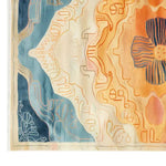A beautifully designed Sunrise Mirage hand-tufted wool area rug, perfect for adding warmth and style to your living room. This 8x10 rug features a stunning abstract pattern with vibrant blue, orange, and cream colors, making it an ideal choice for those seeking unique living room rugs.