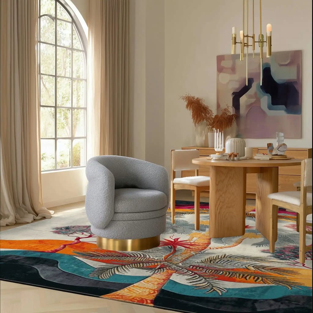 This inviting living room features the Sunset Palms hand-tufted area rug, crafted from high-quality wool. The square rug showcases a vibrant floral design with palm motifs in rich hues, perfect for adding a touch of elegance to large living spaces. A modern gray chair and a wooden dining table set complement the rug's colorful pattern, making it an ideal choice for those seeking stylish rugs for living rooms.