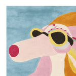 Vibrant hand-tufted area rug featuring a contemporary abstract design of a dog wearing sunglasses against a blue background. Perfect for adding a touch of whimsy to large living room spaces, this wool rug is a standout piece among area rugs for living room decor.