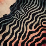 Contemporary area rug with a striking abstract wave pattern in rich black and warm sunset hues, perfect for enhancing a living room space. This hand-tufted wool rug, sized 8x10, adds a touch of modern elegance and softness underfoot.