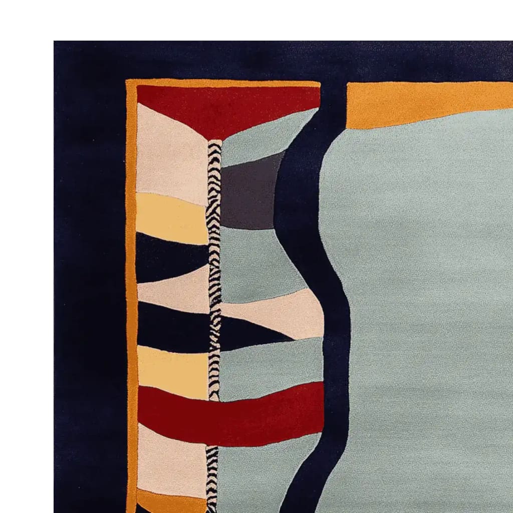 Close-up view of a contemporary wool area rug, showcasing its vibrant, surreal pattern with bold colors. Perfect for enhancing large living rooms, this hand-tufted design combines abstract shapes in red, yellow, blue, and gray, making it an eye-catching centerpiece for any modern space.