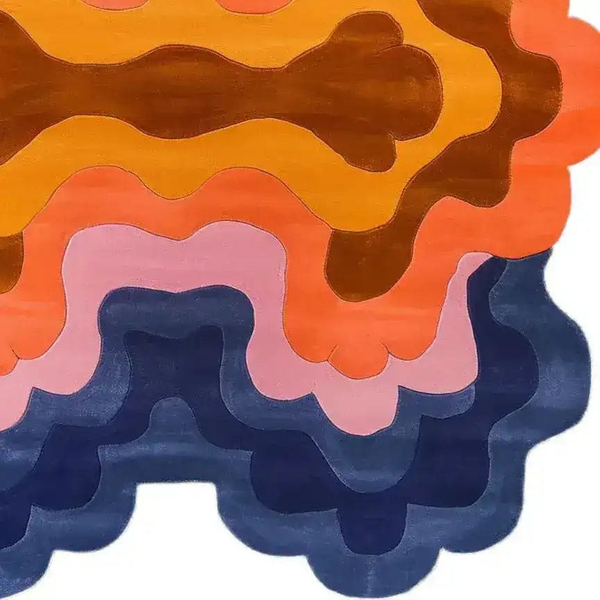 Colorful abstract area rug with swirling patterns in shades of orange, pink, and blue, creating a striking contemporary design. This wool rug is perfect for adding a splash of color to a living room. Ideal for those looking for unique living room rugs in an 8x10 size, this hand-tufted piece serves as a vibrant centerpiece in any modern home.