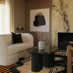 A contemporary living room features a Swirling Sands Tufted Wool Rug, showcasing an abstract design in earthy tones. The large area rug complements the modern decor with a plush sofa and a sleek coffee table, ideal for a stylish 8x10 living room setting.