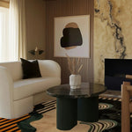 A contemporary living room features a Swirling Sands Tufted Wool Rug, showcasing an abstract design in earthy tones. The large area rug complements the modern decor with a plush sofa and a sleek coffee table, ideal for a stylish 8x10 living room setting.