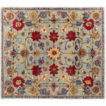 This image showcases a stunning symmetrical hand-tufted area rug, perfect for large living room spaces. The wool rug features an intricate floral pattern with vibrant colors, giving it a vintage charm. Ideal for adding warmth and style to your living room, this floral rug stands out with its detailed design and rich hues.