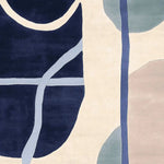 A beautifully designed Tangled Flow Form Hand Tufted Area Rug, featuring an abstract pattern with navy, beige, and pastel shades. Perfect for those looking for contemporary rugs for the living room. This wool rug offers a stylish and modern touch, ideal for living room rugs 8x10.