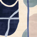 A beautifully designed Tangled Flow Form Hand Tufted Area Rug, featuring an abstract pattern with navy, beige, and pastel shades. Perfect for those looking for contemporary rugs for the living room. This wool rug offers a stylish and modern touch, ideal for living room rugs 8x10.
