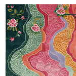 A vibrant tapestry petal path hand tufted area rug featuring a rich floral design with bold colors like green, pink, and orange. This large living room rug is perfect for adding a splash of color to your space. Ideal for those seeking an 8x10 wool rug with a unique and artistic touch.