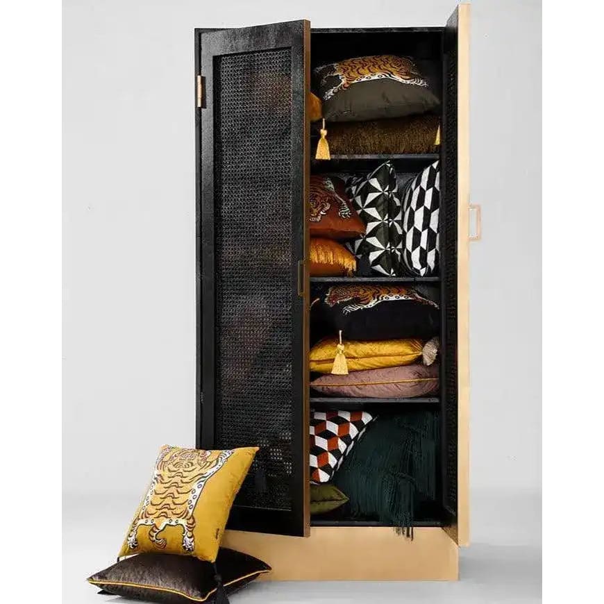 Tassel Tibetan Tiger throw pillow cover displayed with other decorative pillows in a stylish cabinet, showcasing its vibrant colors and intricate design.