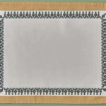 Tassel Trimmed placemat detail showing white linen center with black ornate border and gold fabric edge