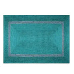 Top view of a Teal and Gray Braided Jute Rug, perfect as an area rug for enhancing your living room decor with its vibrant colors and natural texture.