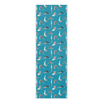 Teal yoga mat printed with a repeating pattern of small figures in varied poses