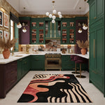 Modern kitchen with green cabinets, a colorful rug on the floor, and decorative elements.