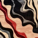 A stunning hand-tufted wool area rug with a modern abstract design featuring flowing waves of black, gray, and red. This contemporary wool rug is perfect for adding an artistic touch to bedrooms or offices, making it an ideal choice for those seeking unique bedroom area rugs.