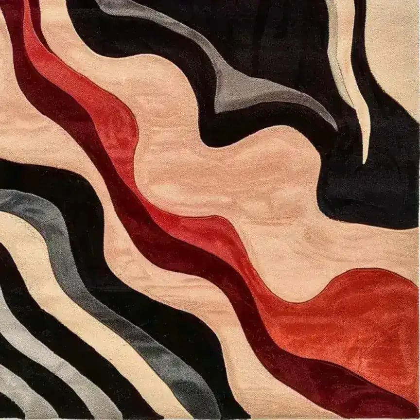 Top view of a contemporary wool area rug titled 'Textured Visions', featuring an abstract design with flowing waves of black, grey, beige, and red. Perfect for adding a modern touch to bedrooms or offices, this hand-tufted wool rug is a stylish choice for those looking for unique bedroom area rugs.