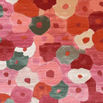 This vibrant area rug features a hand-tufted floral design with a mix of pink, red, green, and orange hues, perfect for large living room spaces. The wool rug is ideal for those seeking an 8x10 living room rug that adds a splash of springtime color and texture.