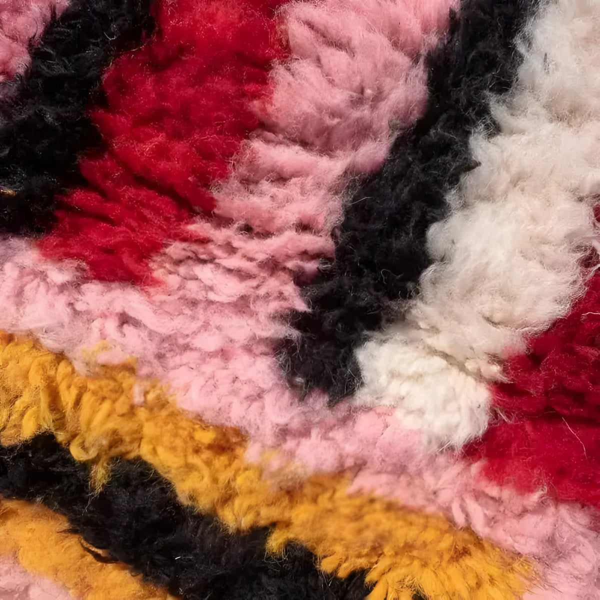 Close-up of The Altas Pink Boujaad Wool Rug Runner showcasing its vibrant colors and thick, plush texture. Perfect for use as a living room area rug, kitchen rug, or bathroom runner rug, this wool rug adds warmth and style to any hallway or office space.