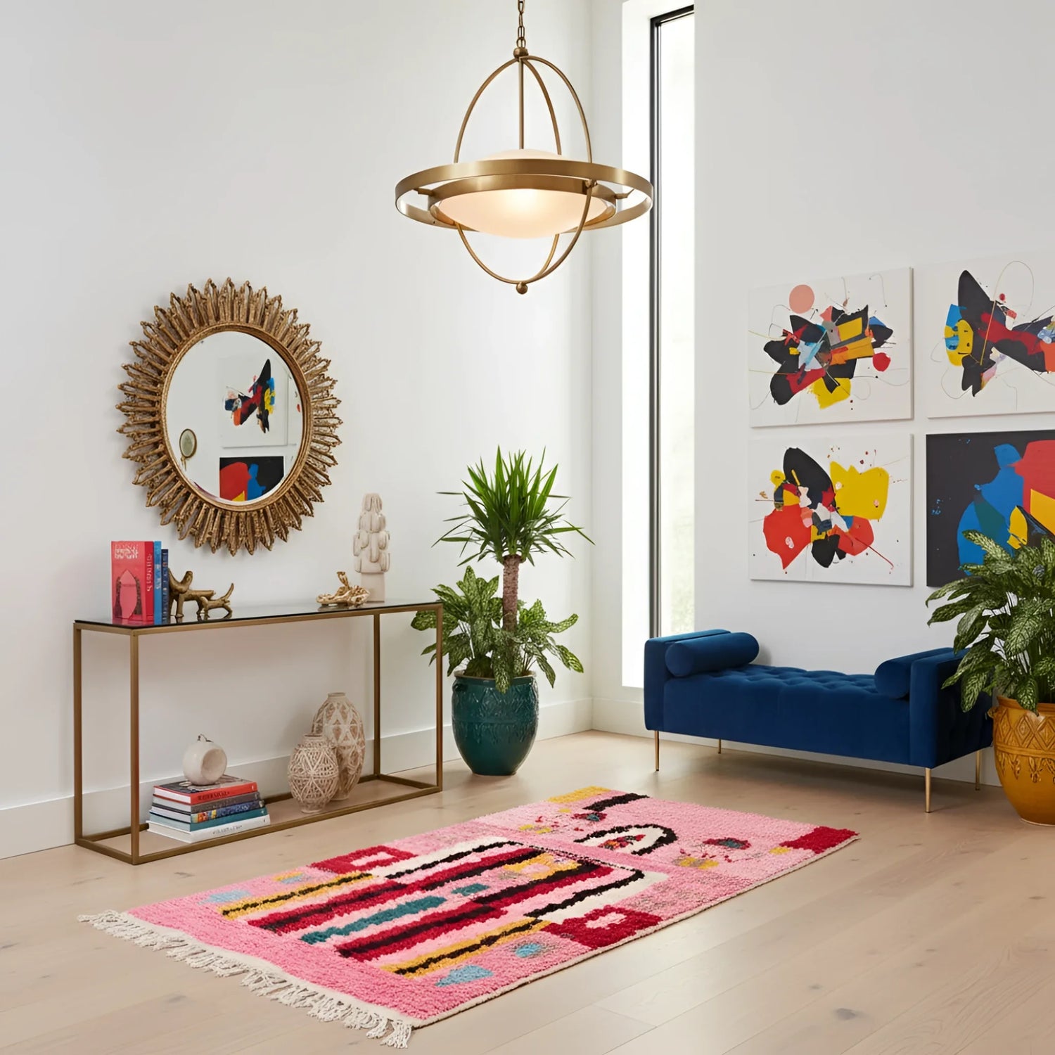 Altas pink Boujaad rug runner in eclectic entryway with gold console, sunburst mirror, and navy bench