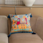 Colorful Asian wild velvet throw pillow cover with intricate designs and tassels, perfect for adding a decorative touch to any living space.