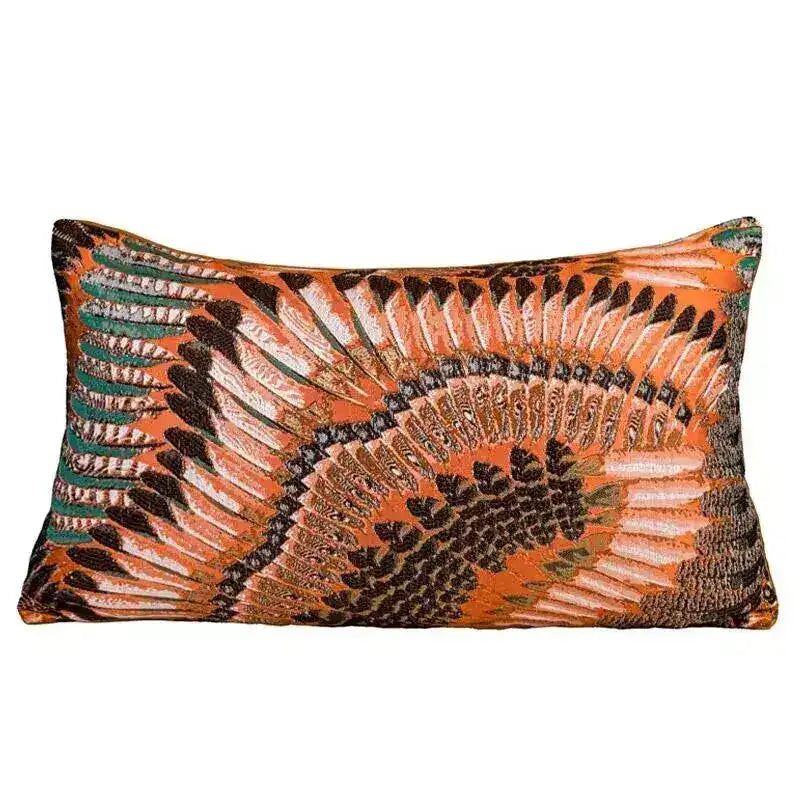 Rust orange lumbar throw pillow cover with embroidered feather-fan motif in cream and teal