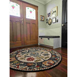 The Blossom Grace Hand Tufted Round Rug adds a touch of elegance to your dining room with its intricate floral patterns and rich colors. This wool area rug is perfect for both dining room carpets and living room settings, offering a warm and inviting feel.