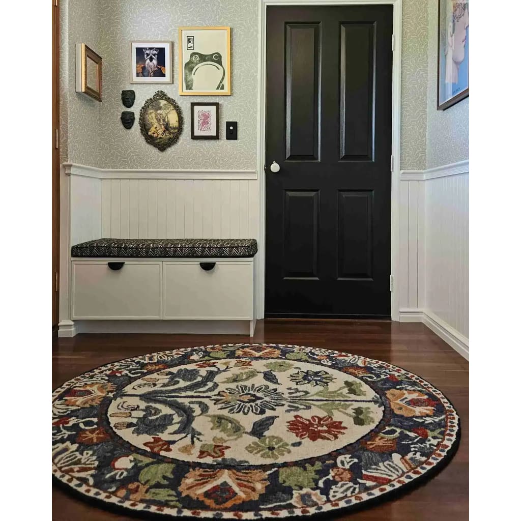 A beautifully hand-tufted round area rug with a vibrant floral design, perfect for enhancing dining room decor. This wool rug adds elegance and style, suitable for both living rooms and dining room areas, offering a cozy and inviting atmosphere.