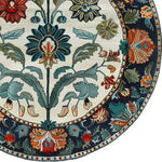 A beautifully detailed Blossom Grace Hand Tufted Round Rug showcasing intricate floral patterns with vibrant colors. Perfect for adding elegance to your dining room or living space. This wool area rug is ideal for those seeking stylish dining room area rugs or living room carpets with a touch of nature-inspired design.