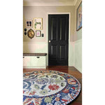 A beautifully designed Blossom Grace Hand Tufted Round Rug with vibrant floral patterns, perfect for enhancing dining room aesthetics. This wool rug adds a touch of elegance to any living space, making it an ideal choice for dining room area rugs and carpets.