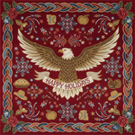 Decorative holiday rug with an eagle and 'Happy Holidays' text on a red background.