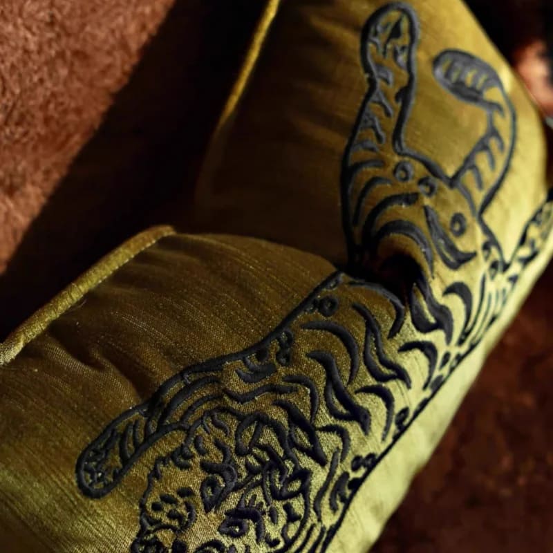 Elegant throw pillow featuring a majestic Bengal tiger design on a golden fabric, perfect for home decor and animal lovers.