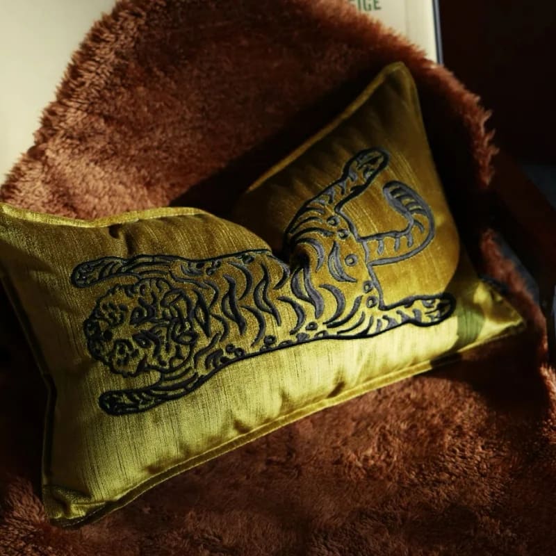 Elegant throw pillow featuring a majestic Bengal tiger design on a golden background, perfect for home decor.