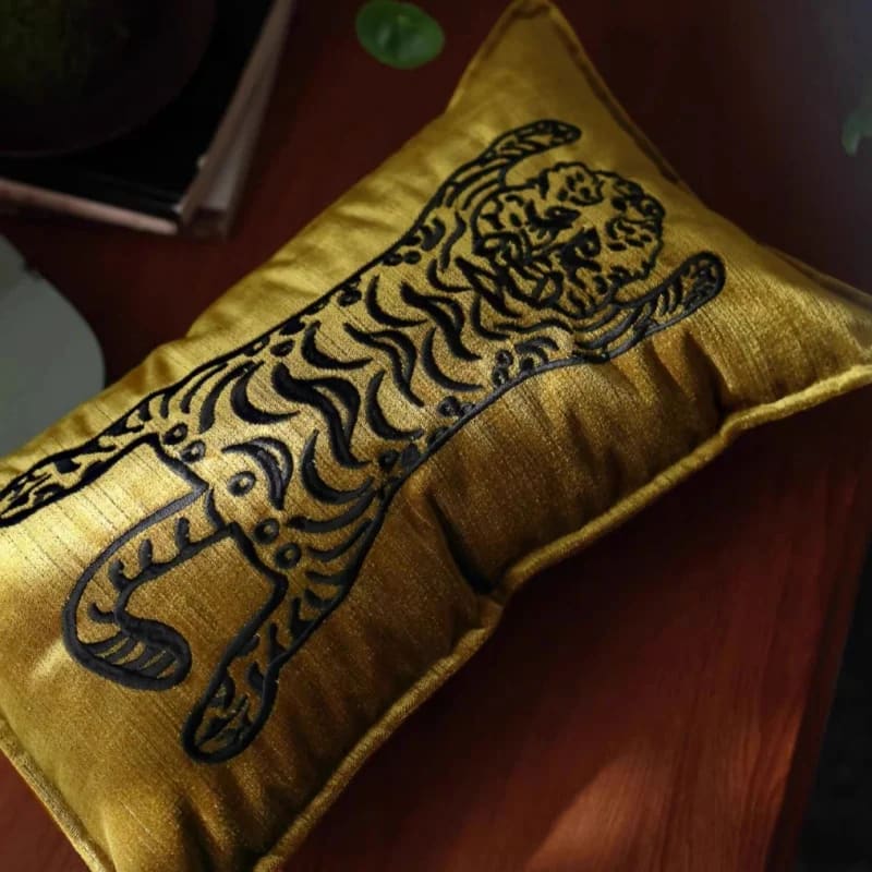 Golden throw pillow featuring a majestic Bengal tiger design, perfect for home decor.