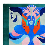 Vibrant abstract design on a hand-tufted wool area rug, perfect for large living rooms. This contemporary square rug features bold colors like blue, orange, and pink, making it an eye-catching piece for any space.