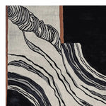 A contemporary area rug featuring a bold abstract design with swirling black and white lines, perfect for large living rooms. This hand-tufted wool rug, sized ideally for 8x10 spaces, adds a modern touch to any home decor.
