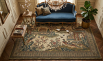 Decorative rug with intricate patterns in a room with a blue sofa and chandelier.