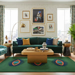 Living room with a green sofa, colorful quirky green rug, and abstract art on the wall.