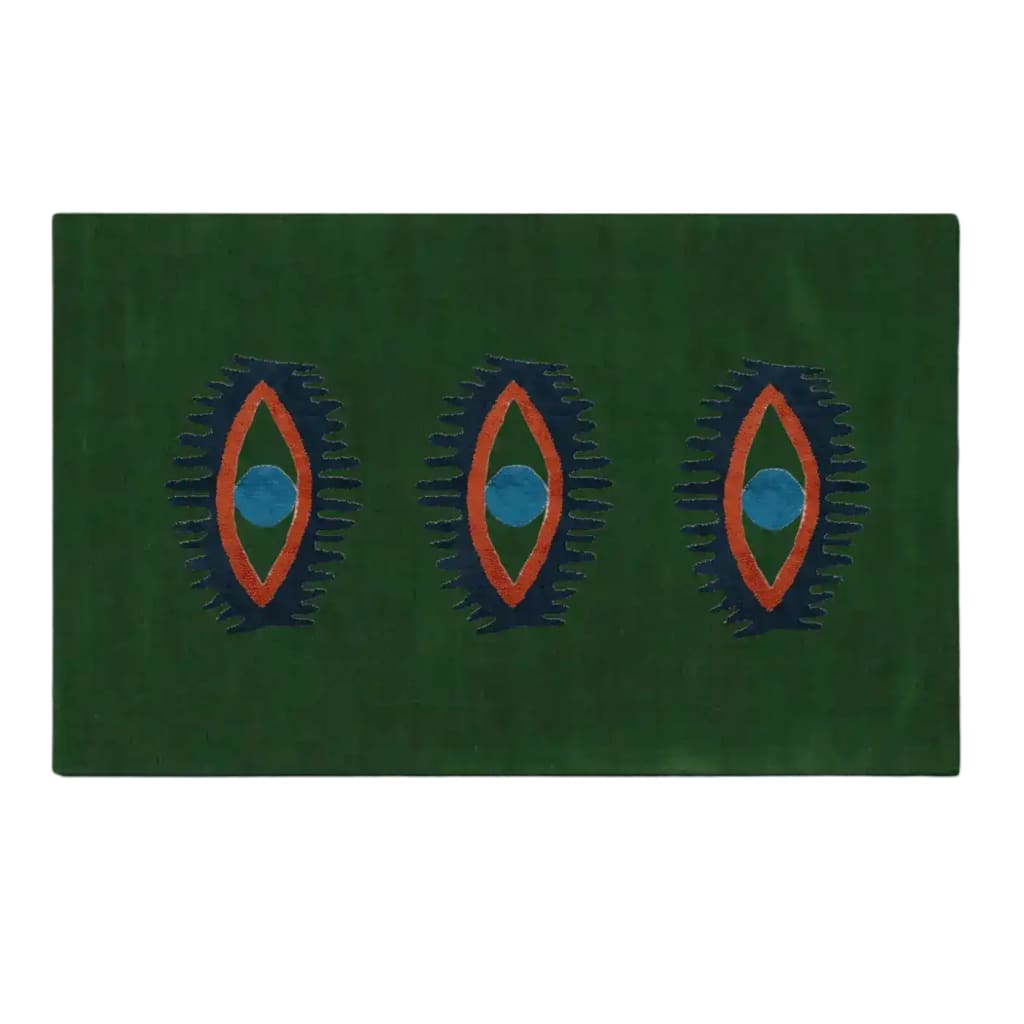 Green hand-tufted wool rug featuring a unique design with three abstract eye patterns in blue and orange. Ideal as an area rug, this versatile piece can enhance spaces like kitchens, bedrooms, or hallways, adding a vintage touch to your home decor.
