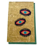 Top view of the Three Evil Eyes Viscose Hand Tufted Wool Rug, featuring a bold and artistic design with three stylized eyes on a beige background, bordered by a green edge. Perfect for adding a unique touch to living room and dining room spaces. This vintage-inspired wool rug is an ideal choice for formal dining room settings.