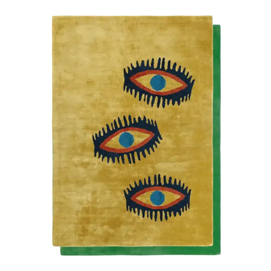 A stylish area rug featuring an abstract design of three eye symbols on a warm yellow background. This wool rug is perfect for adding a vintage touch to living rooms and dining rooms. The bold design makes it an ideal choice for both living room and formal dining room settings.