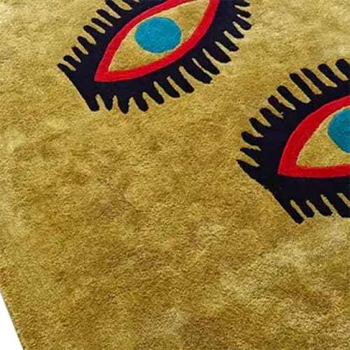 Stylish area rug featuring a bold design with three abstract eyes, perfect for adding a unique touch to living room and dining room spaces. This wool rug combines vibrant colors and a vintage flair, ideal for both casual and formal dining room settings.