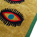 The 'Three Evil Eyes' Viscose Hand Tufted Wool Rug showcases a striking and abstract design with bold eye motifs, perfect for adding an artistic touch to living rooms and dining rooms. This vintage-style area rug, with its intricate patterns and rich colors, is ideal for enhancing the elegance of a formal dining room.
