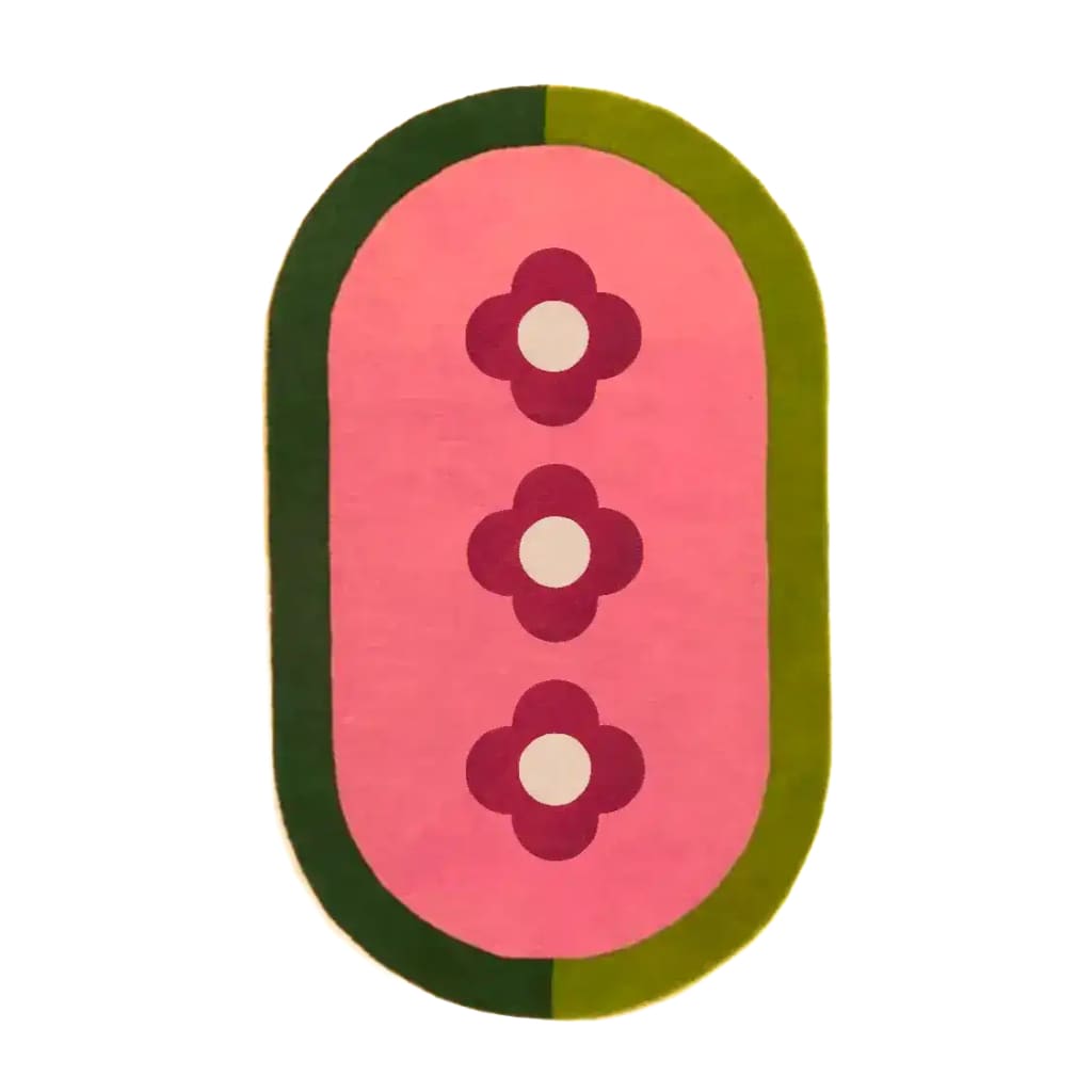 Top view of a hand-tufted wool rug featuring a design of three red flowers on a pink background, surrounded by a green border. This stylish area rug is perfect for adding a touch of elegance to your living room, making it a standout piece among living room area rugs.